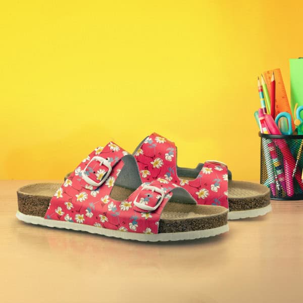 Bright toy rocket and school supplies on wooden table. Space for